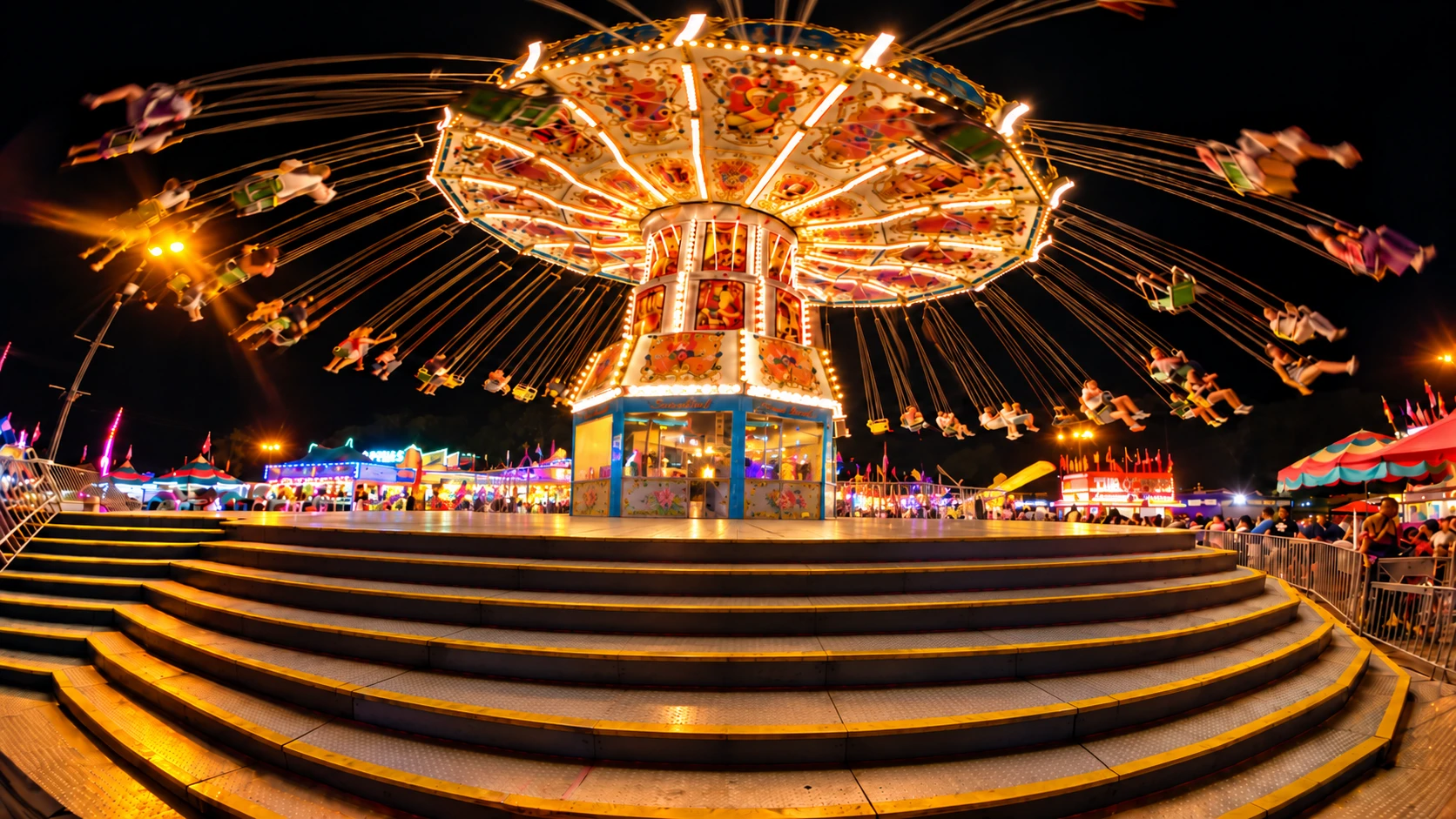 Illuminated swing ride at the California State Fair at night