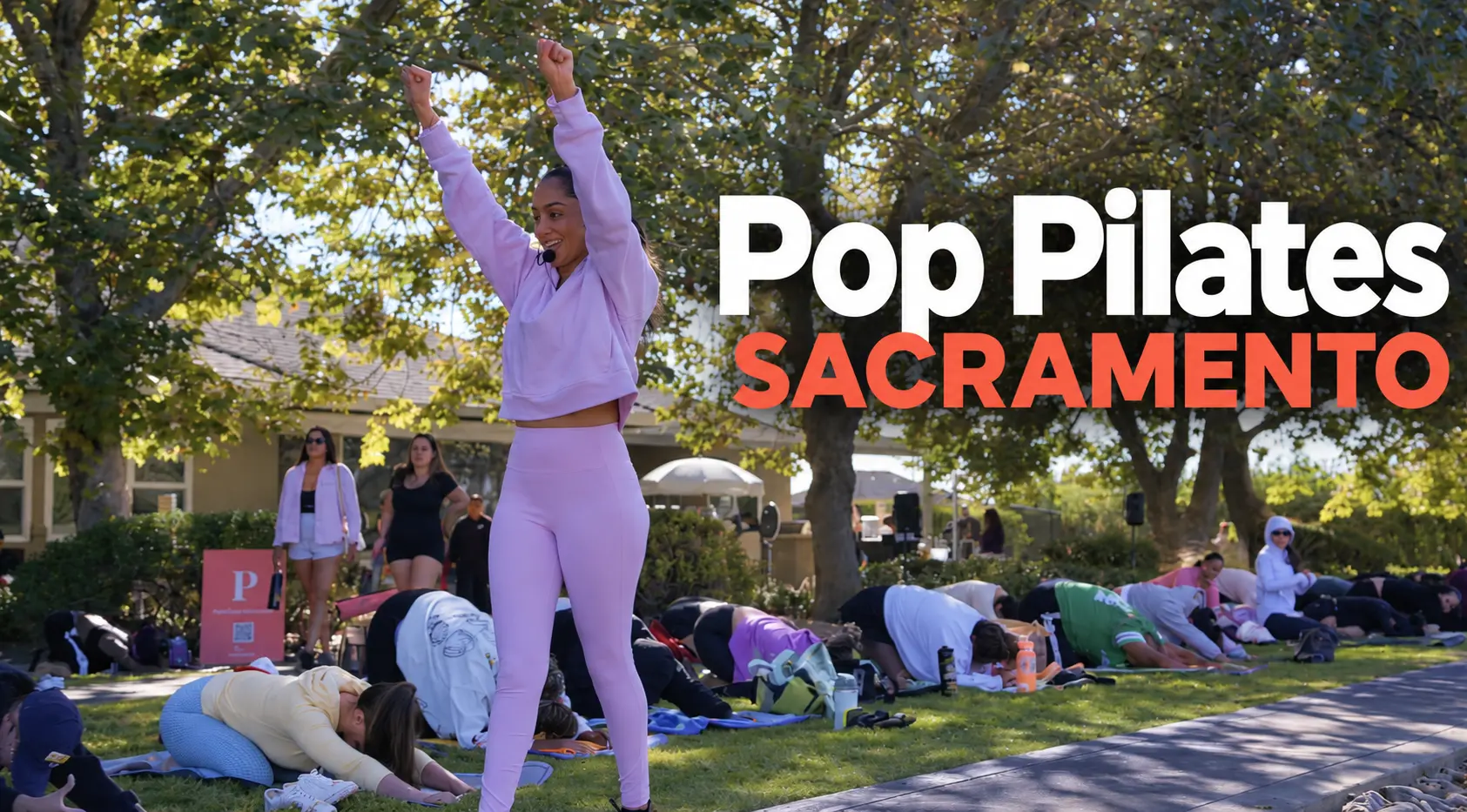 Pop Pilates Sacramento instructor leading an outdoor group class beneath the trees
